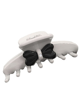 Medium White Hair Claw with a Black Dragonfly Shaped Embelishments finished off with Pink Hues